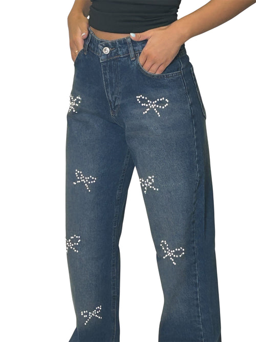 Blue jeans with decorative bow patterns 